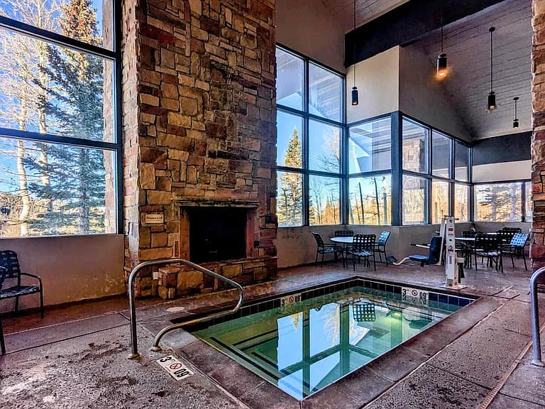 Heated pool and hot tub area at the lodge